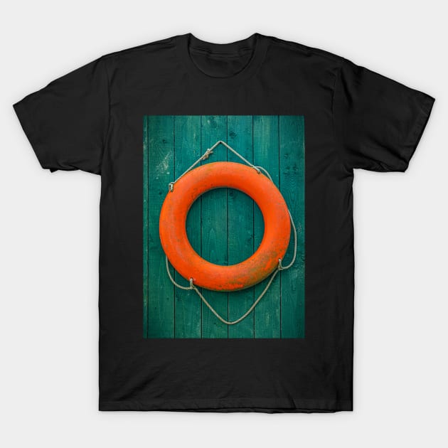Orange Lifesaver on Green Wooden Wall T-Shirt by TonyNorth